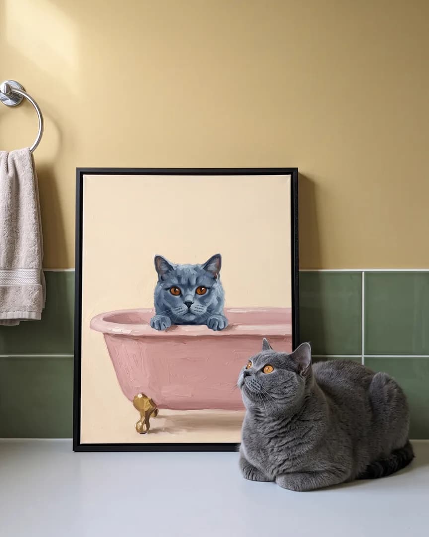 Earl, a British shorthair, beside a black framed canvas of their own Powder Pink Bath portrait.