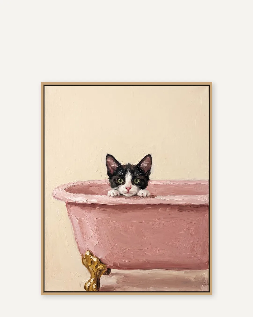 A natural-oak float-framed canvas of Oreo, a tuxedo domestic shorthair kitten, in the Powder Pink Bath style.