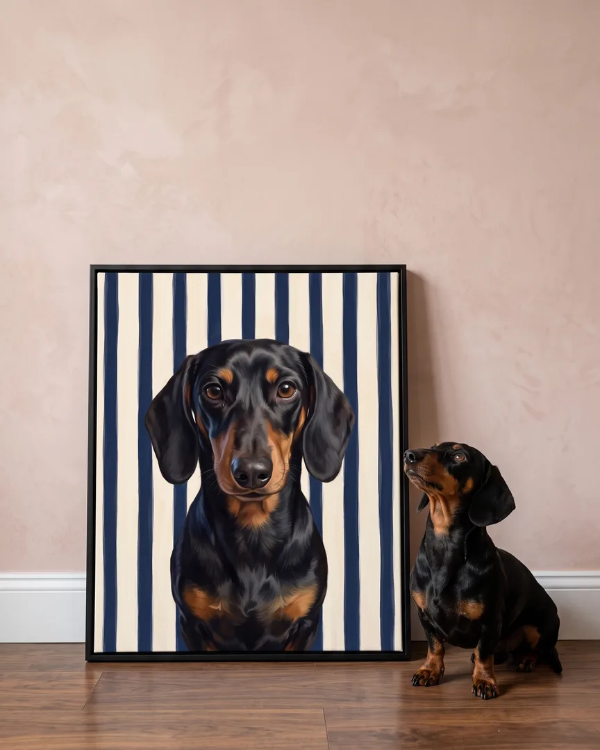 Ziggy, a dachshund, beside a black framed canvas of their own Riviera Stripe portrait.