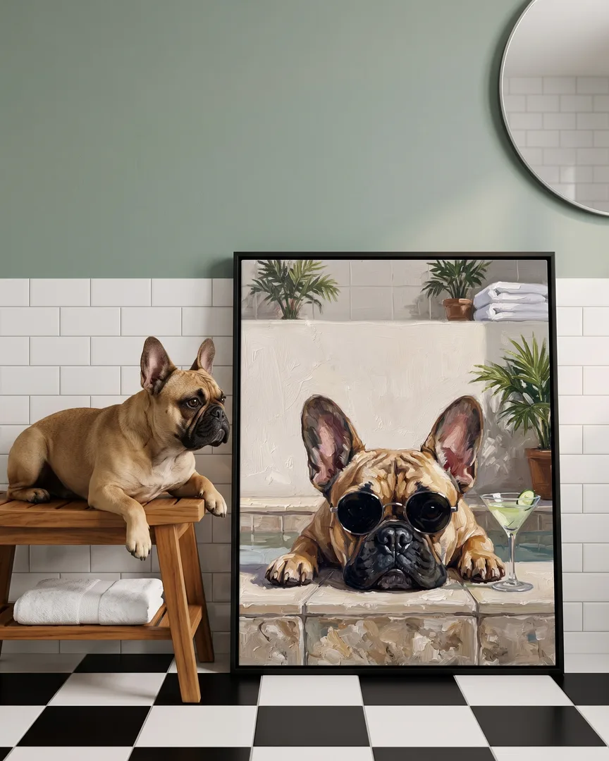 Gus, a French bulldog, beside a black framed canvas of their own Tub Edge Shades portrait.