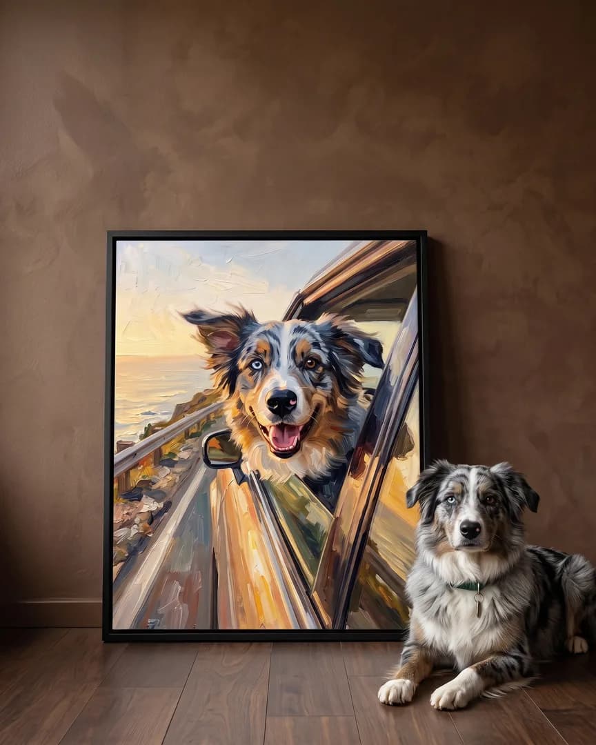 Koda, an Australian shepherd, beside a black framed canvas of their own Wind and Waves portrait.