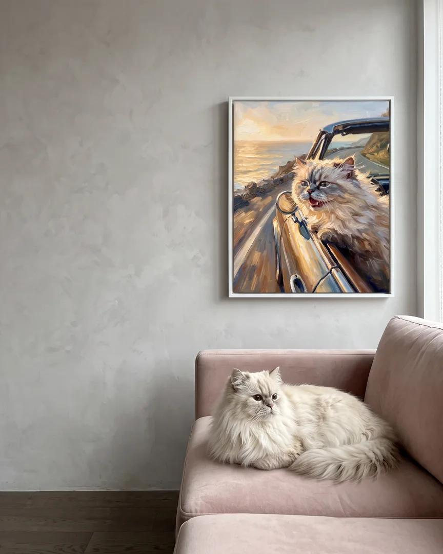 Frost, a Persian, beside a white framed canvas of their own Wind and Waves portrait.